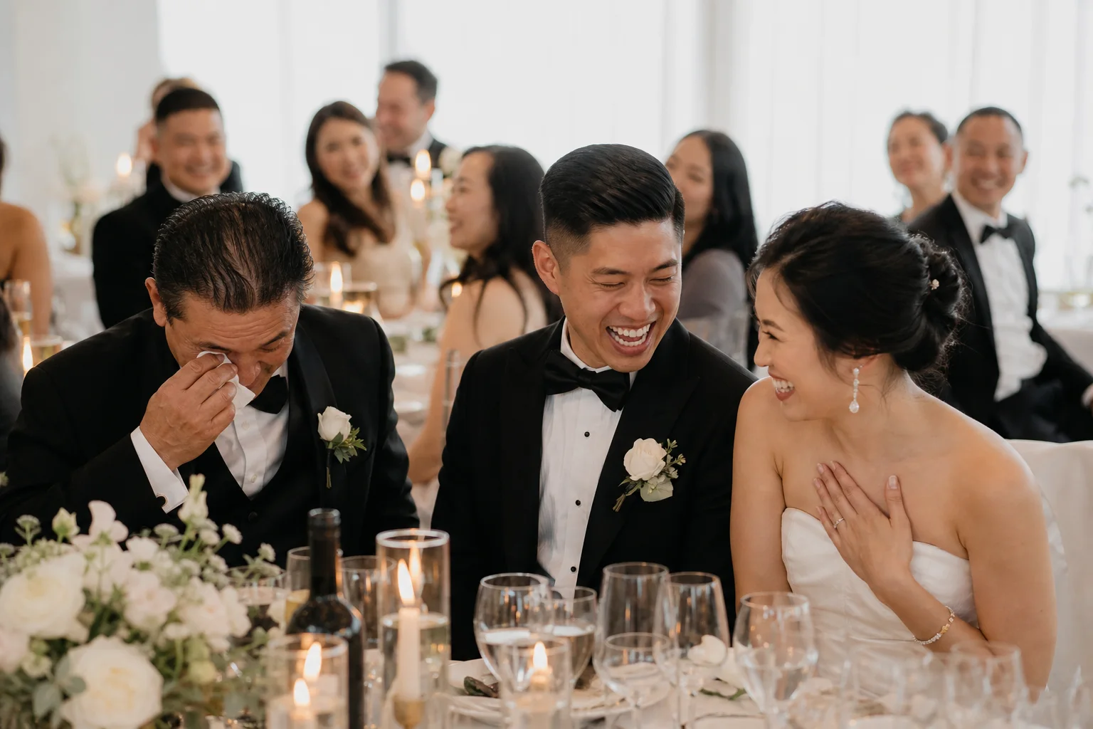 Unposed emotional moment between family members during a wedding reception