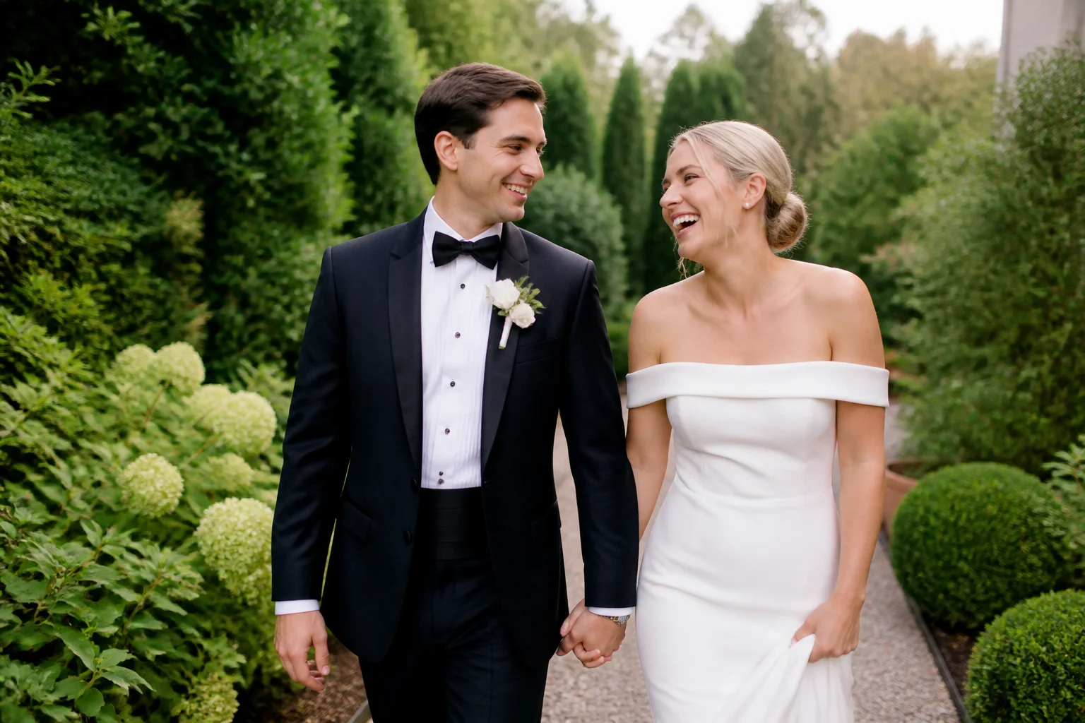 Newlyweds walking and laughing naturally with gentle photographer direction