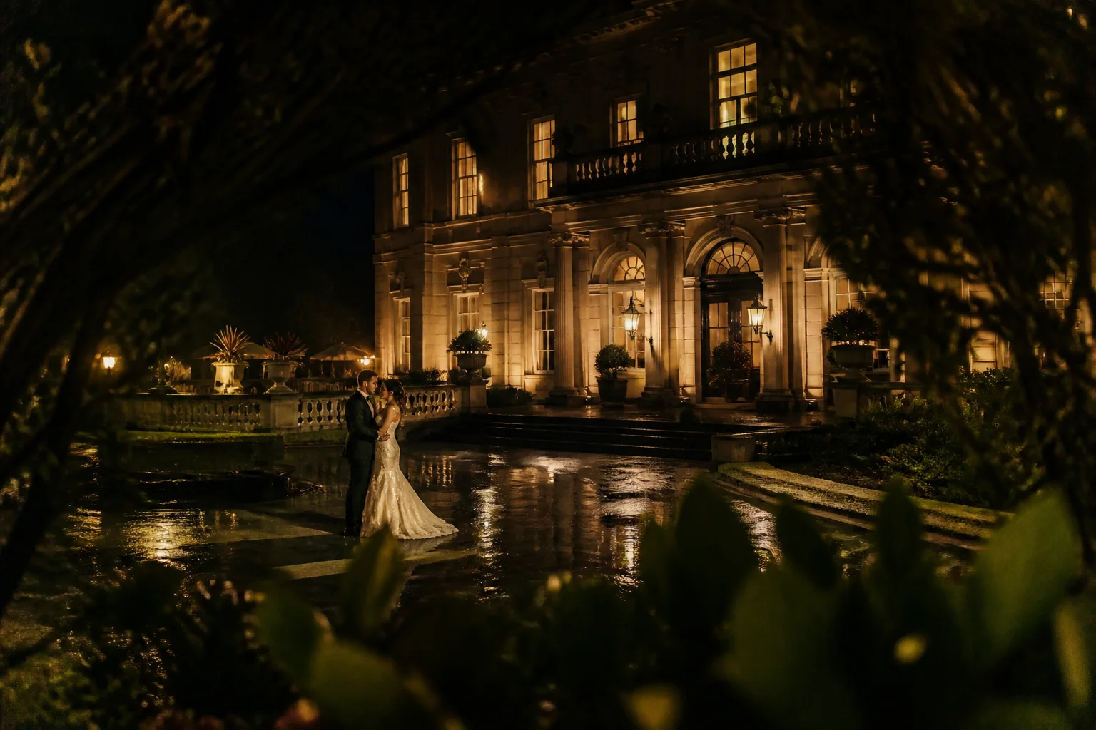 Cinematic night wedding portrait with dramatic lighting and a strong sense of place